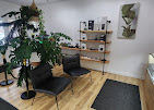 Customer seating area inside the Acadia Botanicals Penfield store